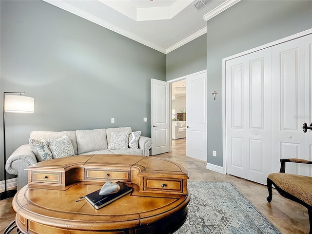 living room with crown molding and a high ceiling