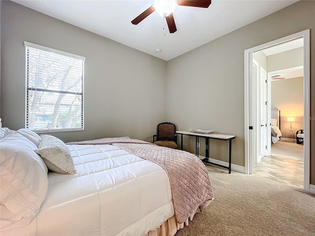 bedroom featuring light carpet, multiple windows, and ceiling fan