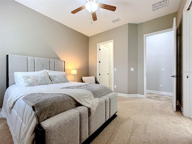 bedroom featuring ceiling fan and light colored carpet