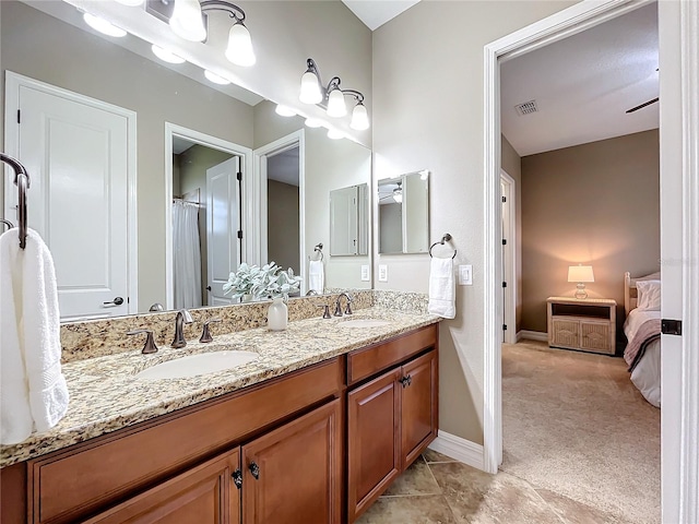 bathroom featuring ceiling fan and vanity