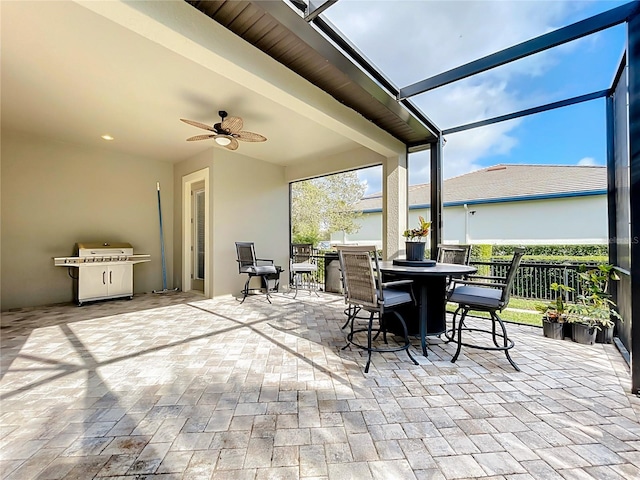 view of patio / terrace with a lanai and ceiling fan