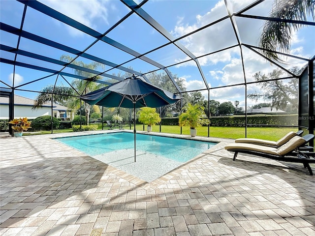 view of swimming pool with a lanai and a patio