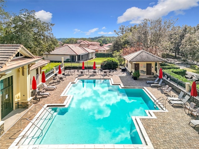 view of swimming pool with a patio