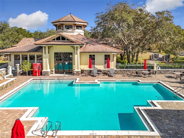 view of swimming pool with a patio area