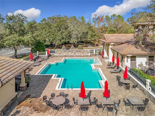 view of swimming pool with a patio area