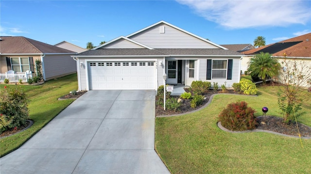 ranch-style house featuring a front lawn and a garage