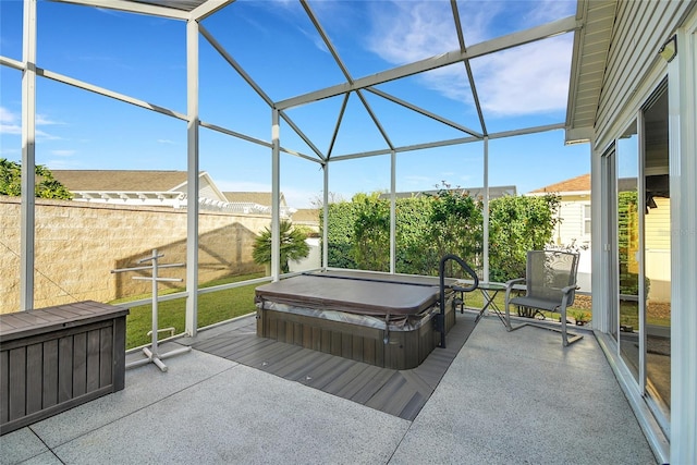 sunroom with a hot tub