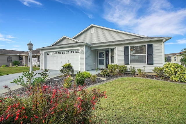 ranch-style house featuring a garage and a front lawn