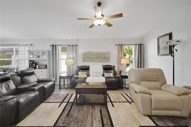 living room with ceiling fan and light hardwood / wood-style floors