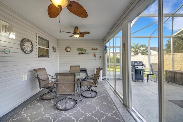 sunroom with ceiling fan and plenty of natural light