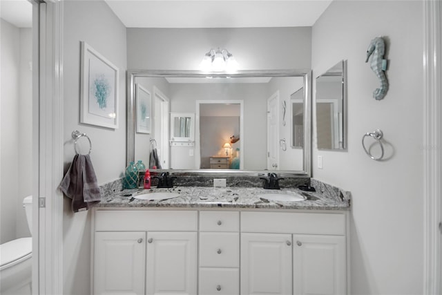 bathroom with vanity and toilet