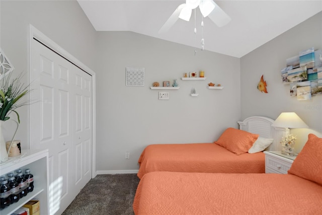 bedroom featuring vaulted ceiling, dark carpet, a closet, and ceiling fan