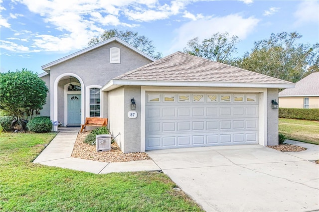 ranch-style home with a garage and a front lawn