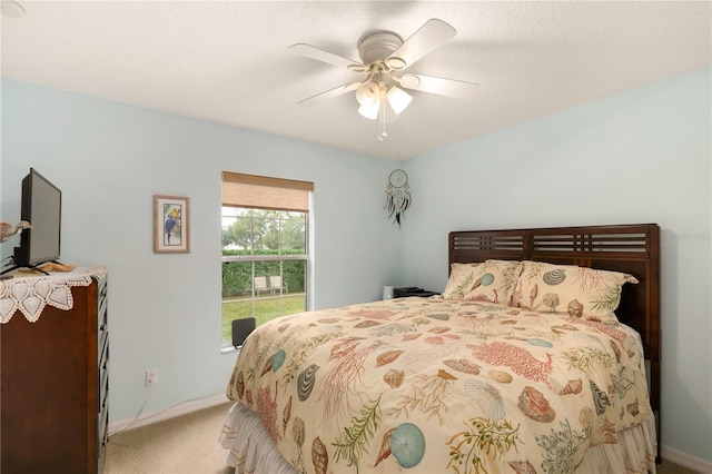 bedroom with light colored carpet and ceiling fan