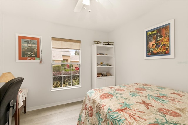 bedroom featuring multiple windows, ceiling fan, and light hardwood / wood-style floors