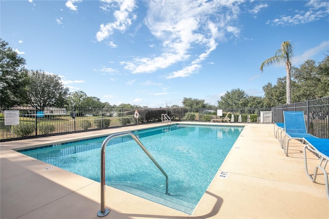 view of swimming pool with a patio area