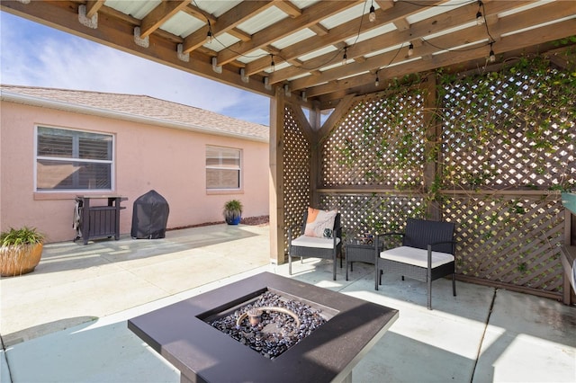 view of patio / terrace featuring a pergola and an outdoor fire pit