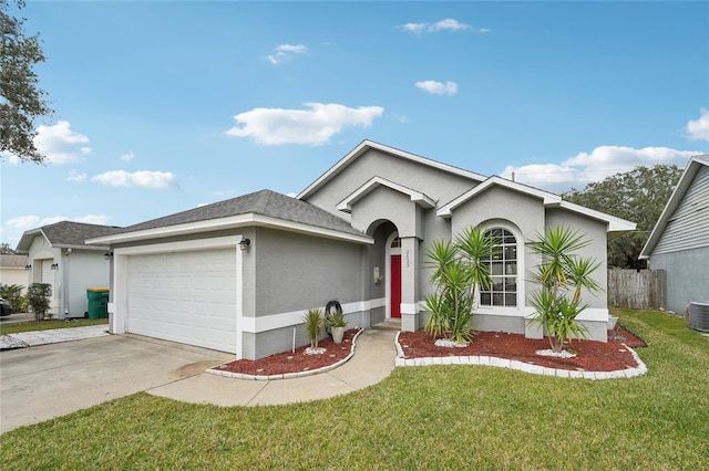 single story home featuring a garage, a front yard, and central AC