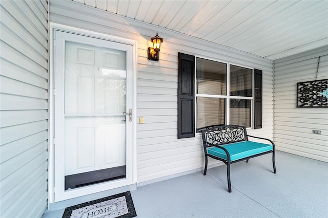 entrance to property featuring covered porch