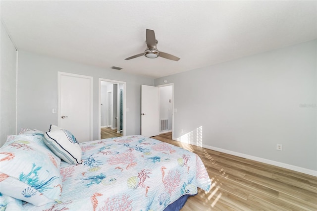 bedroom featuring ceiling fan and hardwood / wood-style floors