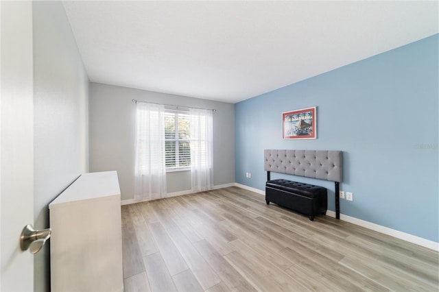 unfurnished room featuring light hardwood / wood-style floors