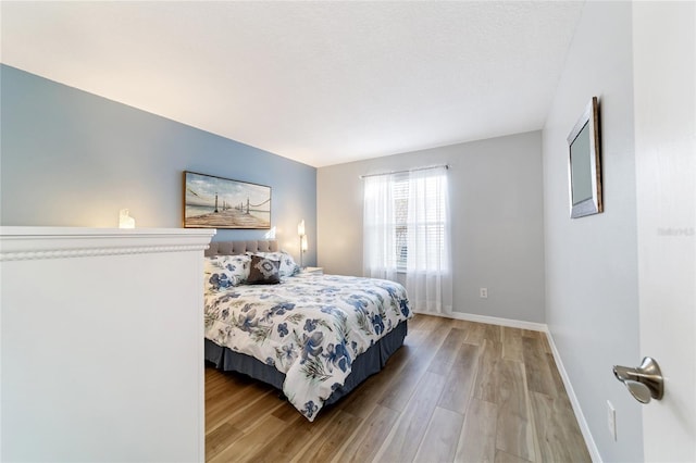 bedroom with light wood-type flooring