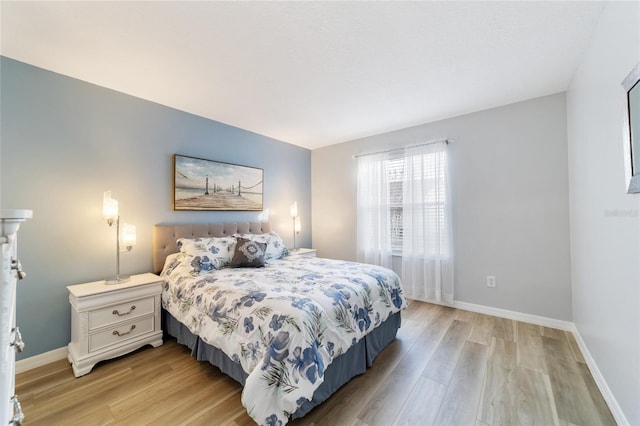 bedroom with light hardwood / wood-style flooring