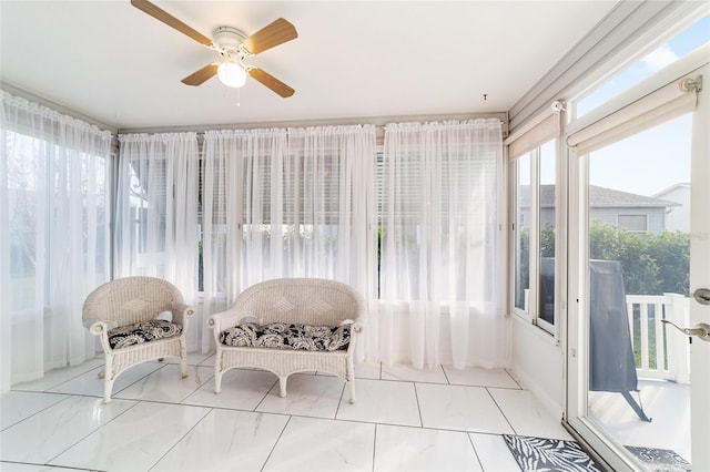 sunroom / solarium with ceiling fan