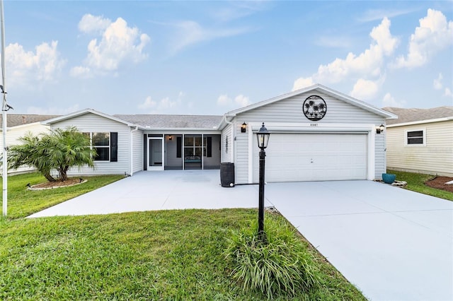 ranch-style house with a front yard and a garage