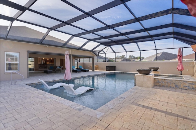 view of pool with an outdoor living space, a hot tub, and glass enclosure