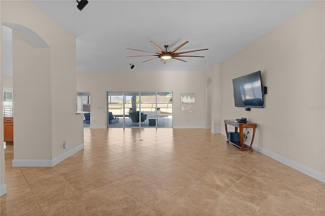 interior space featuring ceiling fan and light tile patterned floors