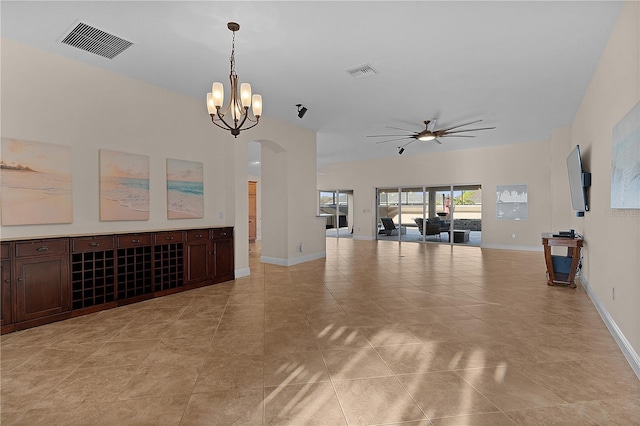 unfurnished living room featuring light tile patterned floors and ceiling fan with notable chandelier