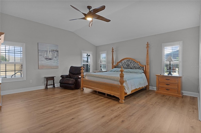 bedroom featuring ceiling fan, lofted ceiling, and light wood-type flooring