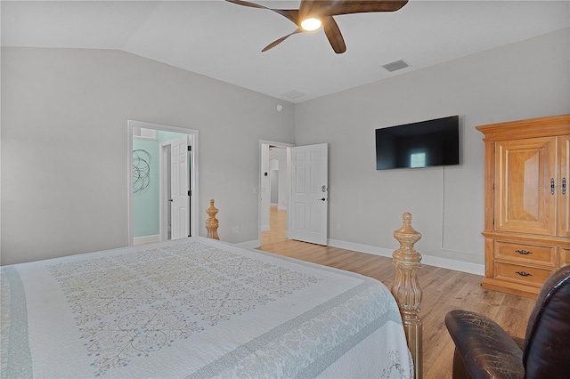 bedroom featuring ceiling fan, light hardwood / wood-style flooring, and lofted ceiling