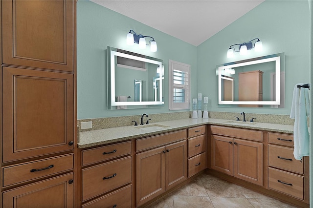 bathroom with tile patterned floors and vanity