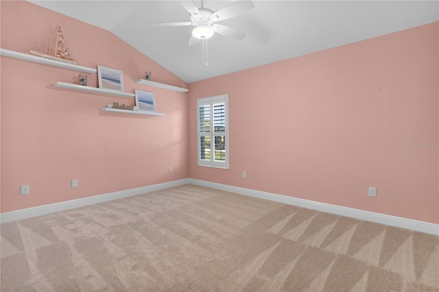 unfurnished room featuring light colored carpet, ceiling fan, and lofted ceiling