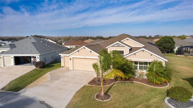 view of front of house featuring a front lawn and a garage