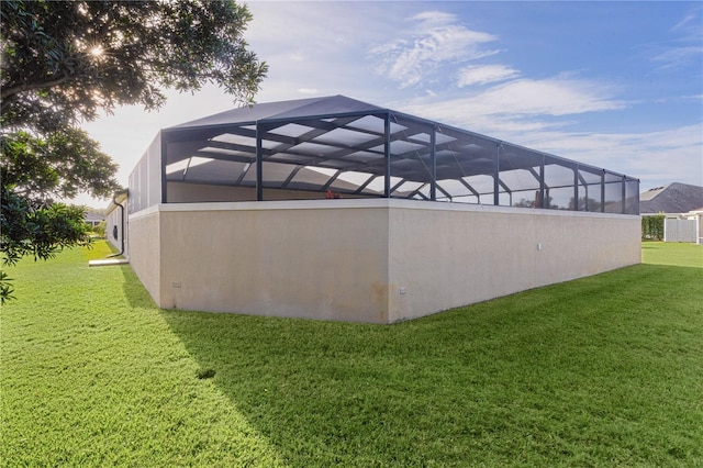 back of property featuring a yard and a lanai