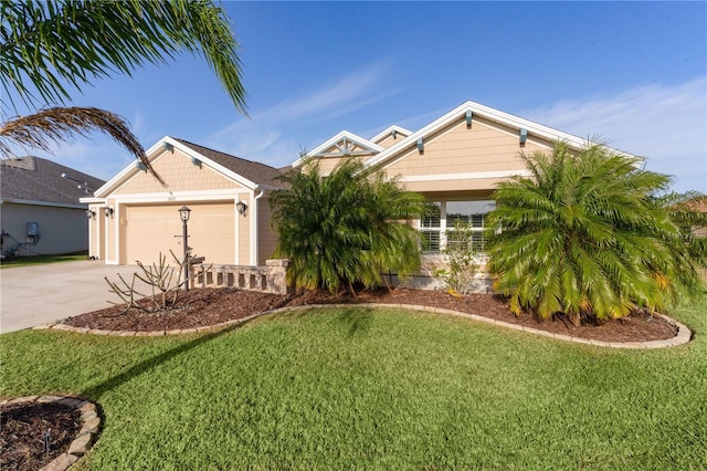 view of front of property featuring a front lawn and a garage