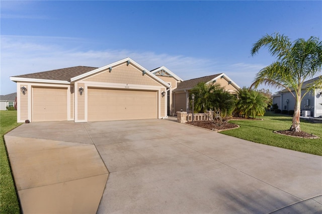 view of front of home featuring a front lawn and a garage