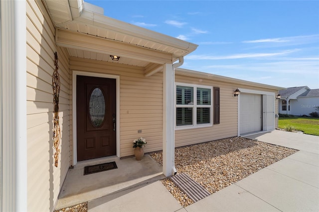 view of exterior entry featuring a garage