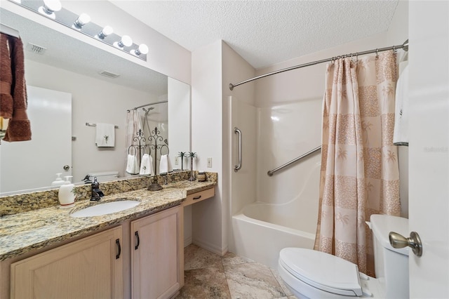 full bathroom featuring vanity, toilet, shower / bathtub combination with curtain, and a textured ceiling