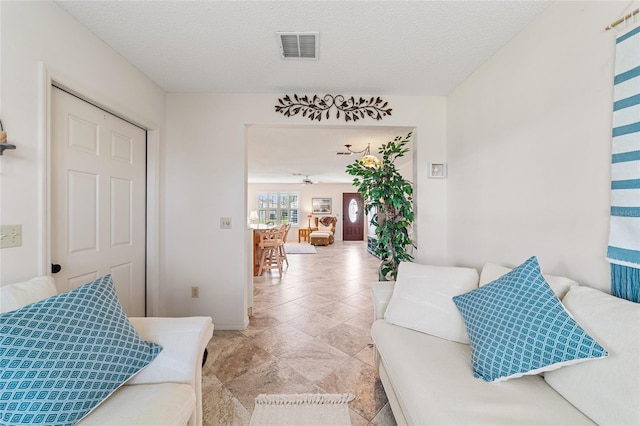 living room featuring a textured ceiling