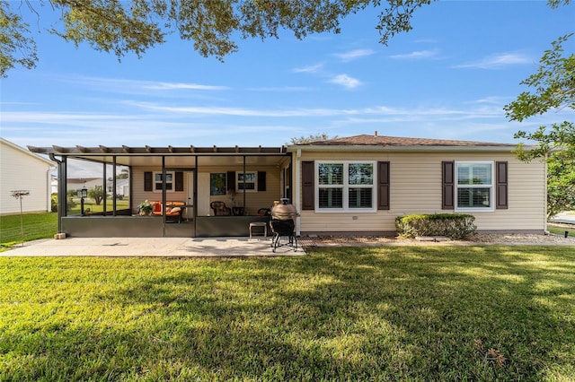 back of house featuring a yard and a patio area