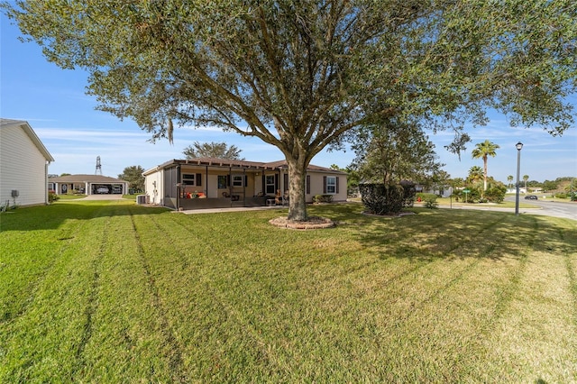 view of yard featuring a patio and central AC