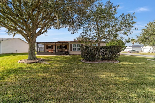 back of house featuring a patio and a lawn