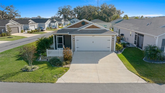 view of front of house featuring a front yard and a garage