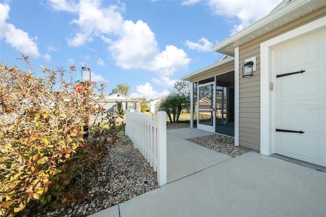 view of patio with a sunroom