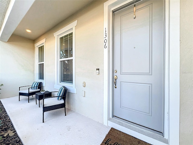 doorway to property featuring covered porch