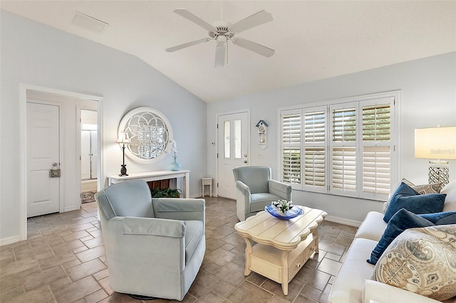 living room featuring ceiling fan and lofted ceiling